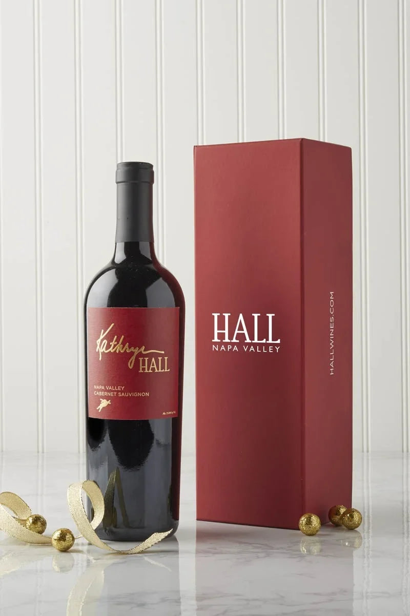 Image of the 2022 Kathryn Hall Cabernet Gift Set featuring a bottle of HALL's Kathryn Hall Cabernet and a red branded gift box.